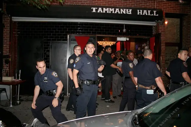 Cops get down outside Tammany Hall.